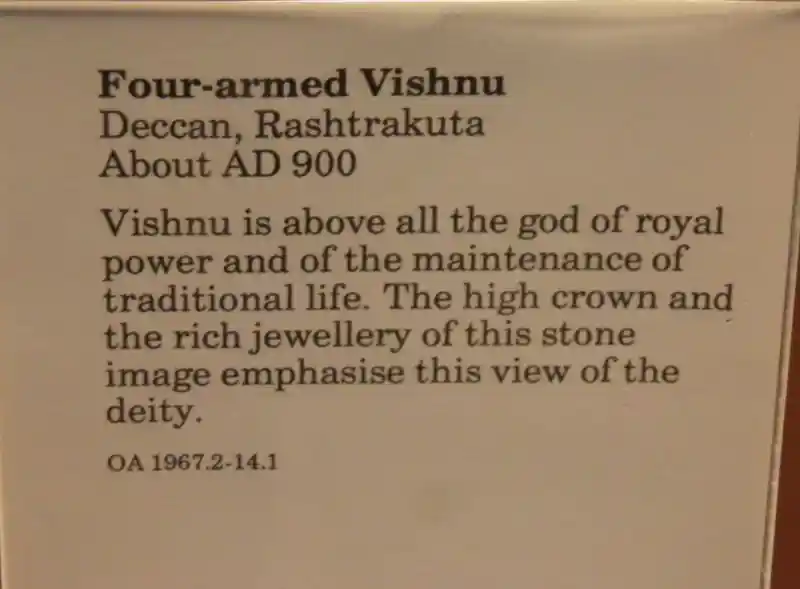 A cross inside a circle on the statue of four-armed Vishnu